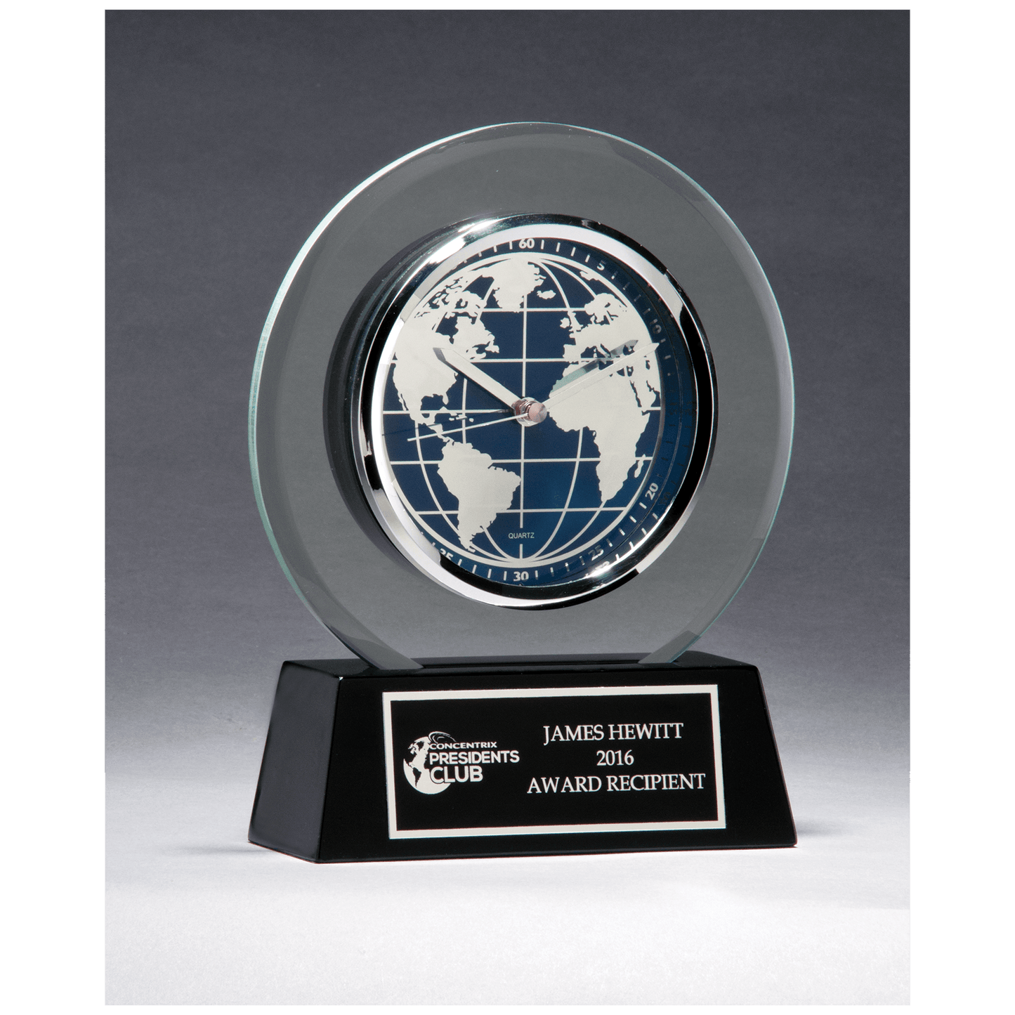 Glass clock with world time dial on a black high gloss base