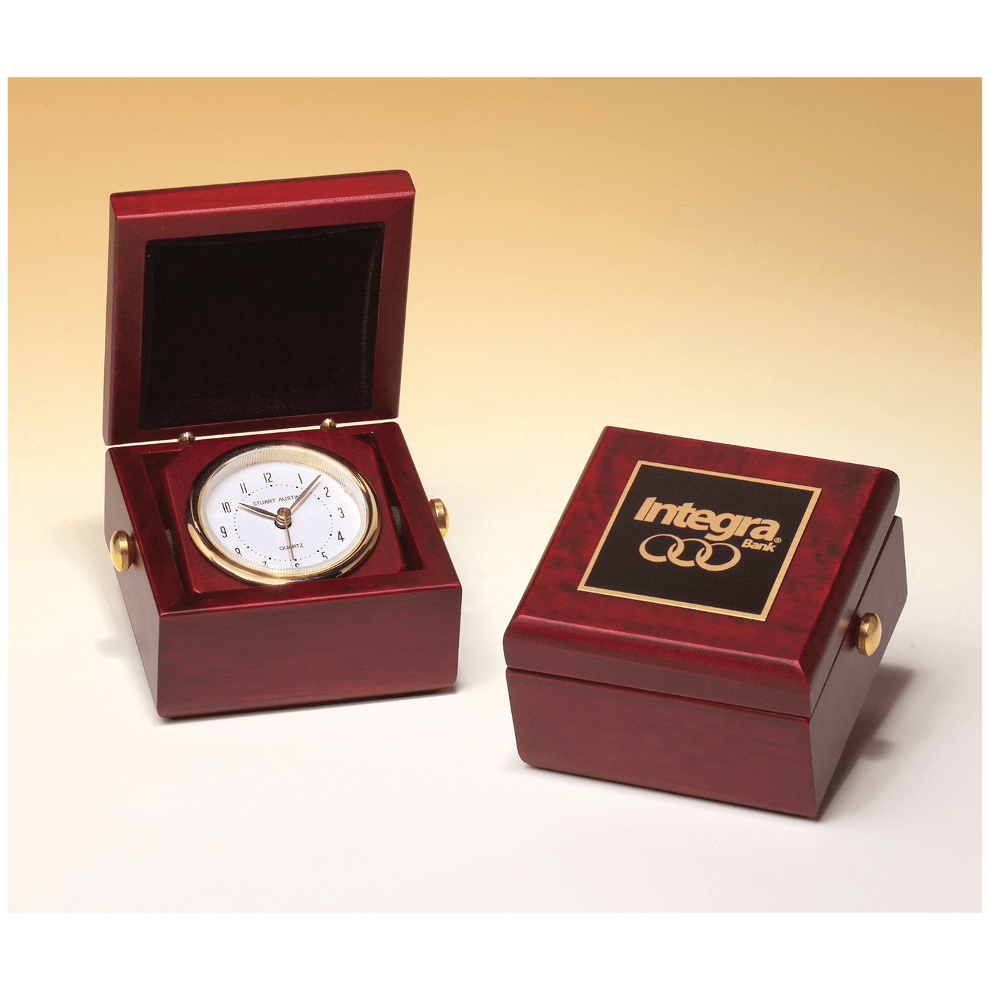 Hand rubbed mahogany box clock with goldtone knobs and velour lined lid