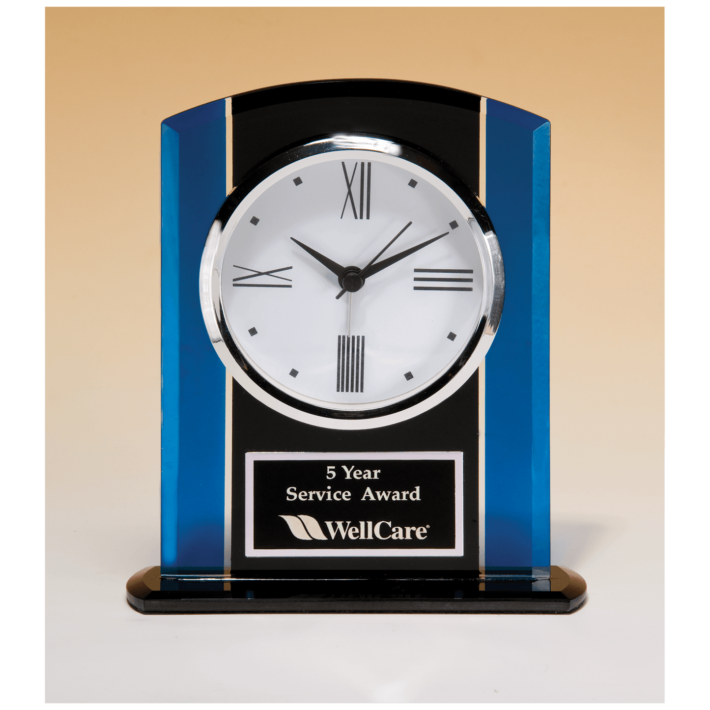 Black and blue glass clock with silver bezel and three hand movement