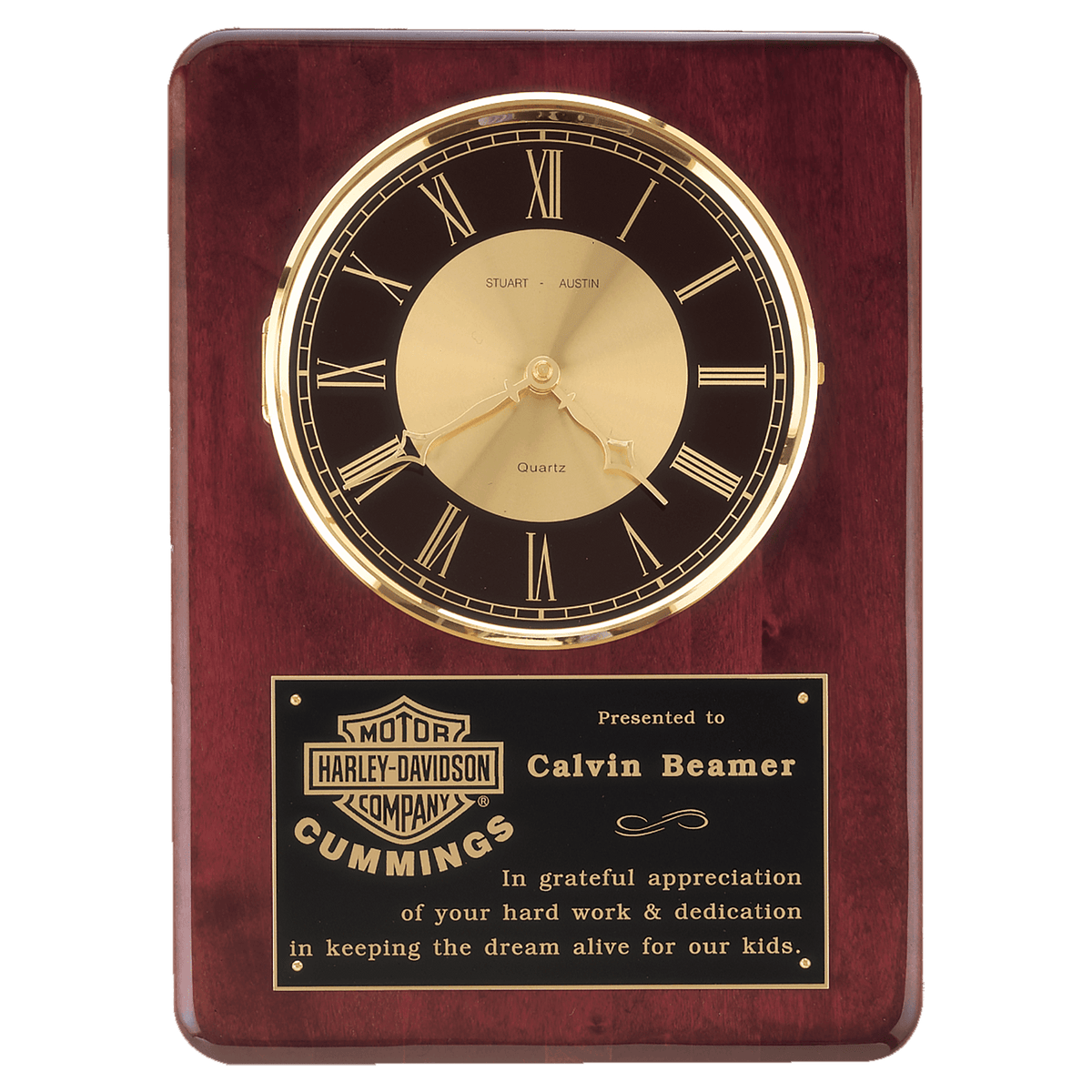 Rosewood piano finish wall clock with brass bezel, glass lens and black and gold dial