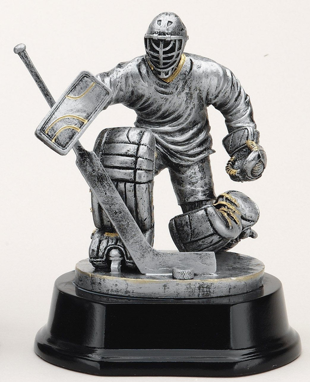 Silver ice hockey goalie trophy on rosewood-finish base