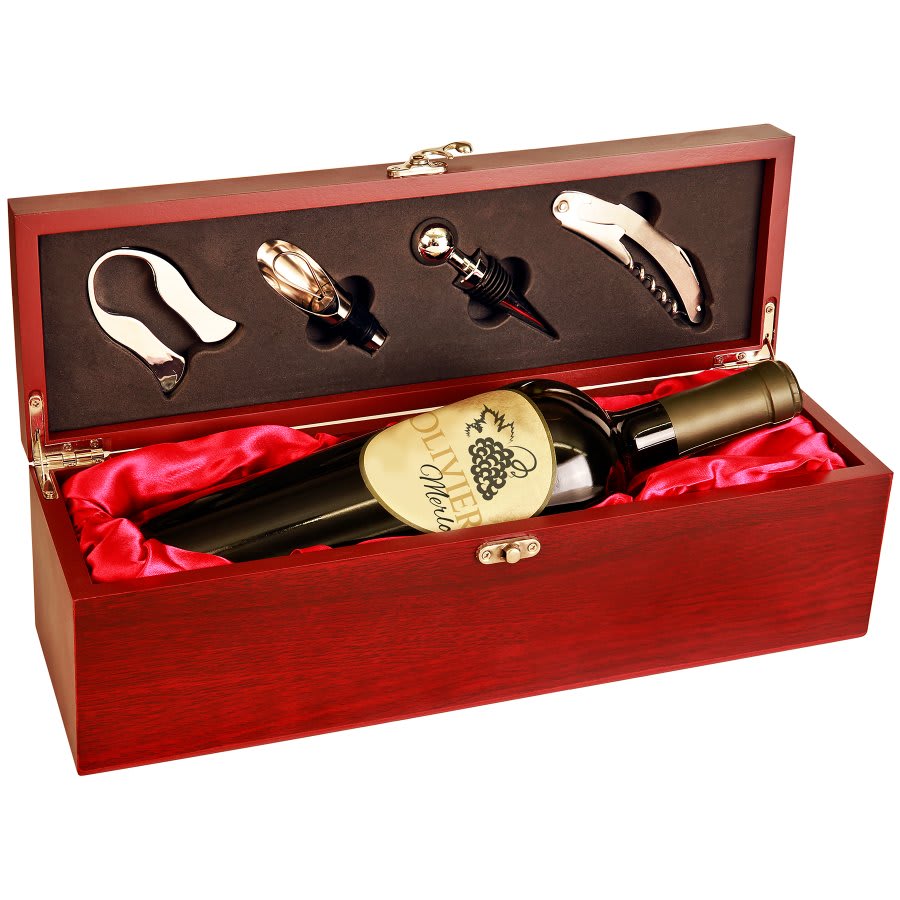 Wine bottle set with accessories in a red wooden box on a white background
