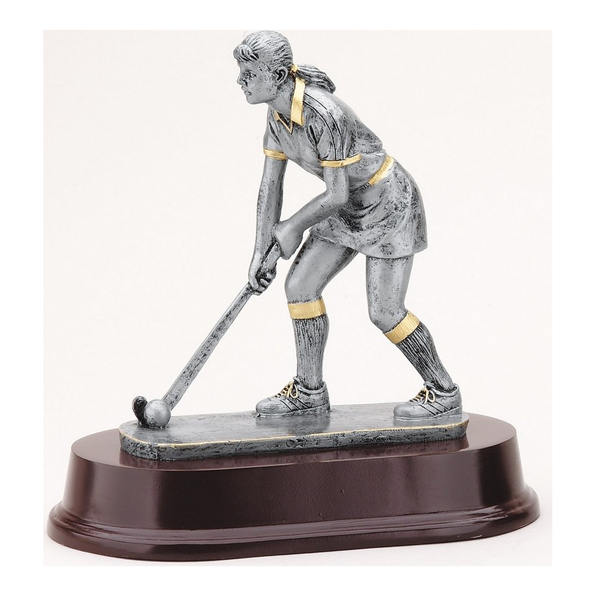 Female field hockey player resin trophy in antique silver with gold accents on a rosewood-finish base