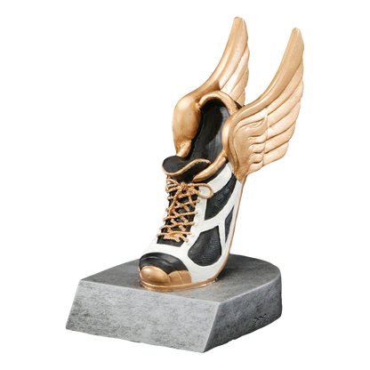 Winged track shoe trophy with a white spike and gold wings on a silver base