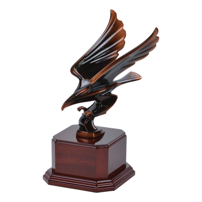 Angled view of the striking eagle award on a cherry-finish wood base
