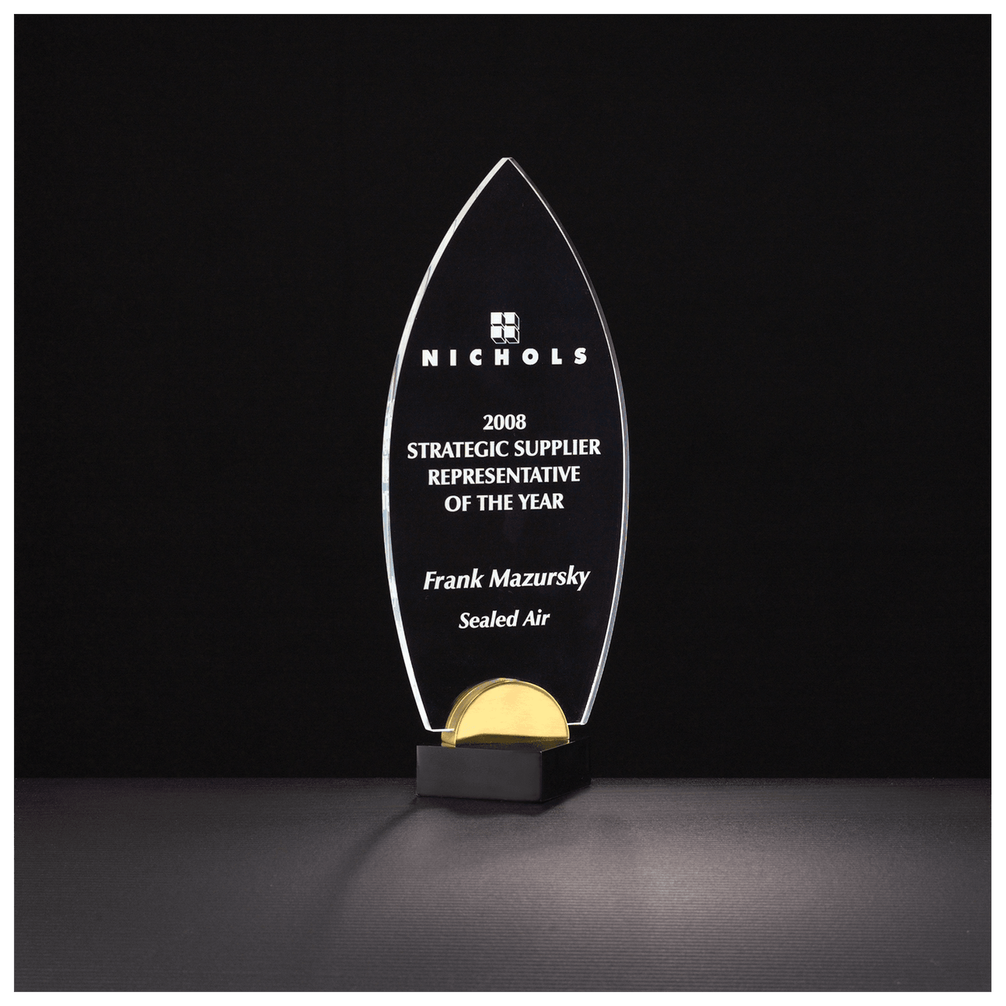 Flame Series clear acrylic award on black and gold metal base, 4 x 9¾ inches, engraved