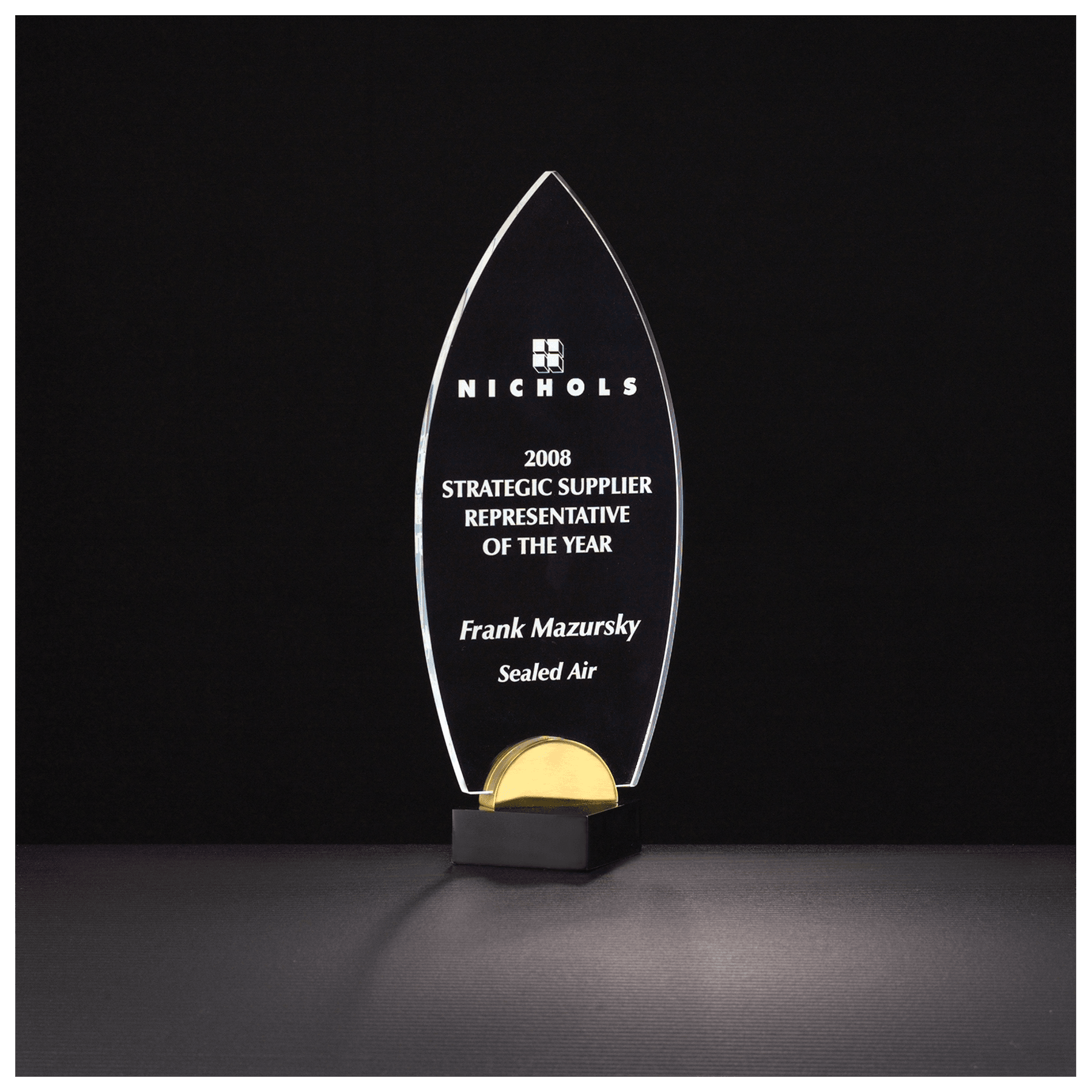 Flame Series clear acrylic award on black and gold metal base, 4 x 9¾ inches, engraved