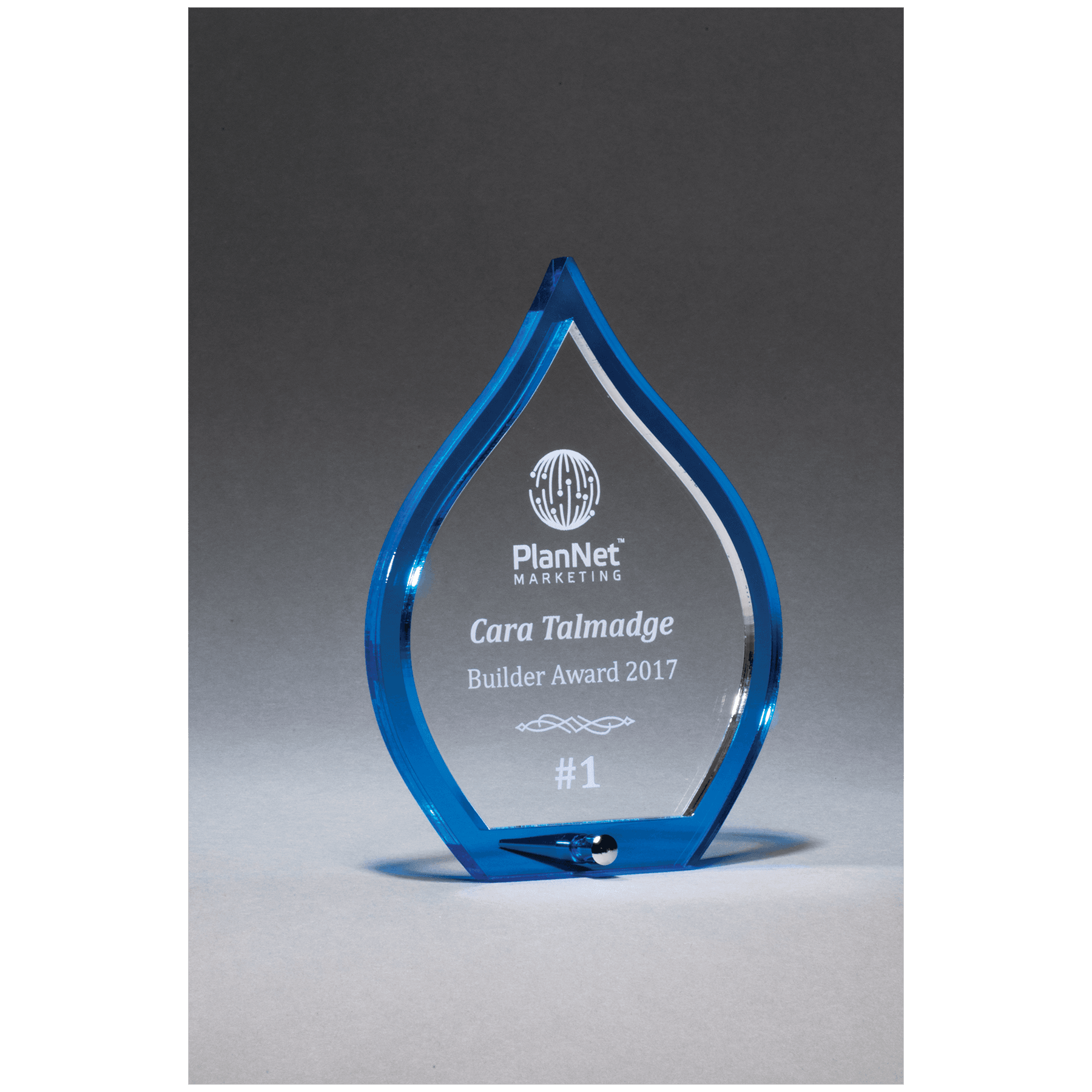 Blue flame acrylic award with clear pop-out center and silver post, 4½ x 6¼ inches, engraved