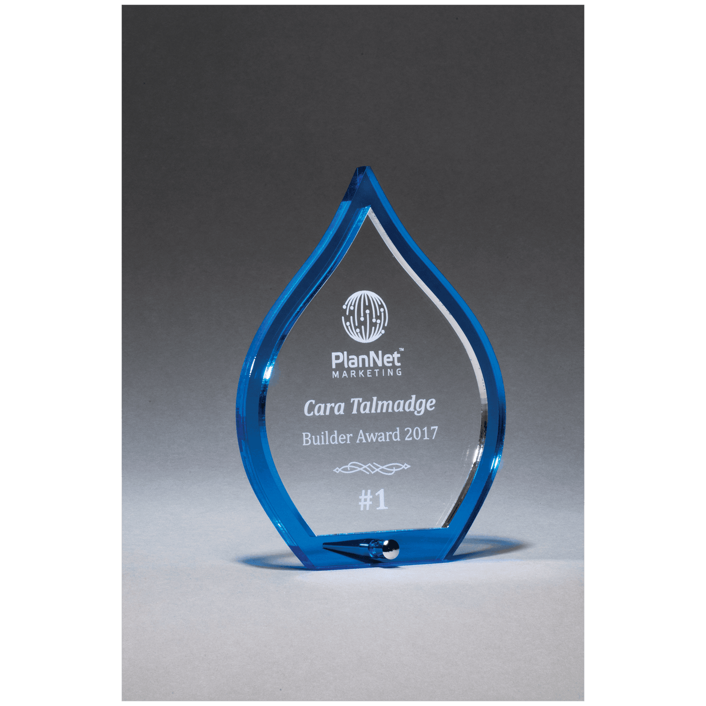 Blue flame acrylic award with clear pop-out center and silver post, 6 x 8¼ inches, engraved
