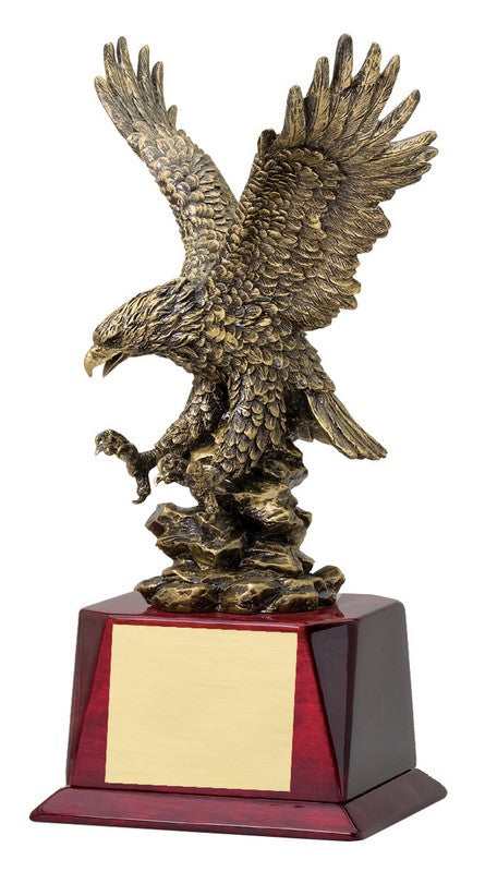 Gold-finish landing eagle with spread wings on a rosewood base with engraving plate, 14½" size