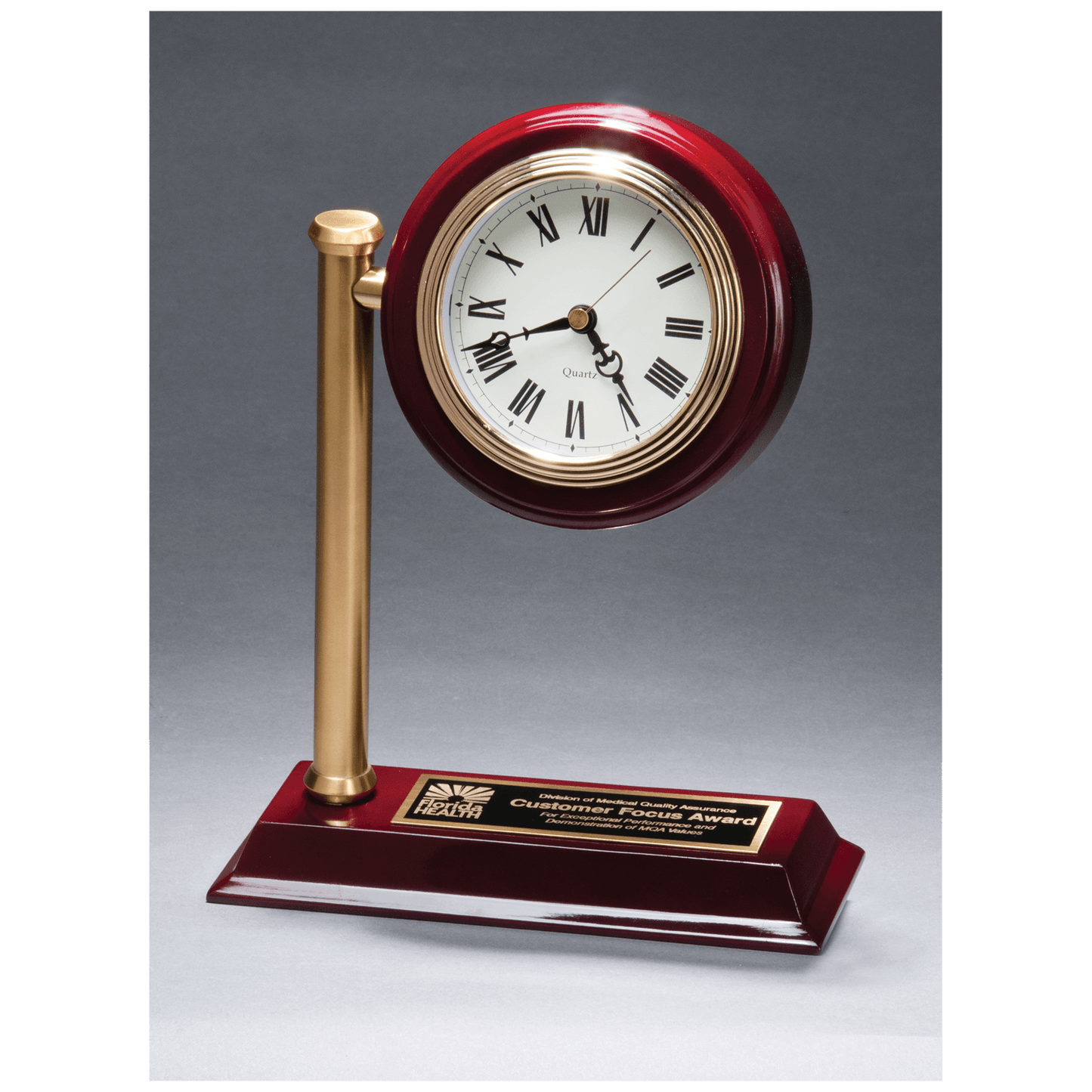 Rail station style desk clock on a rosewood high gloss base