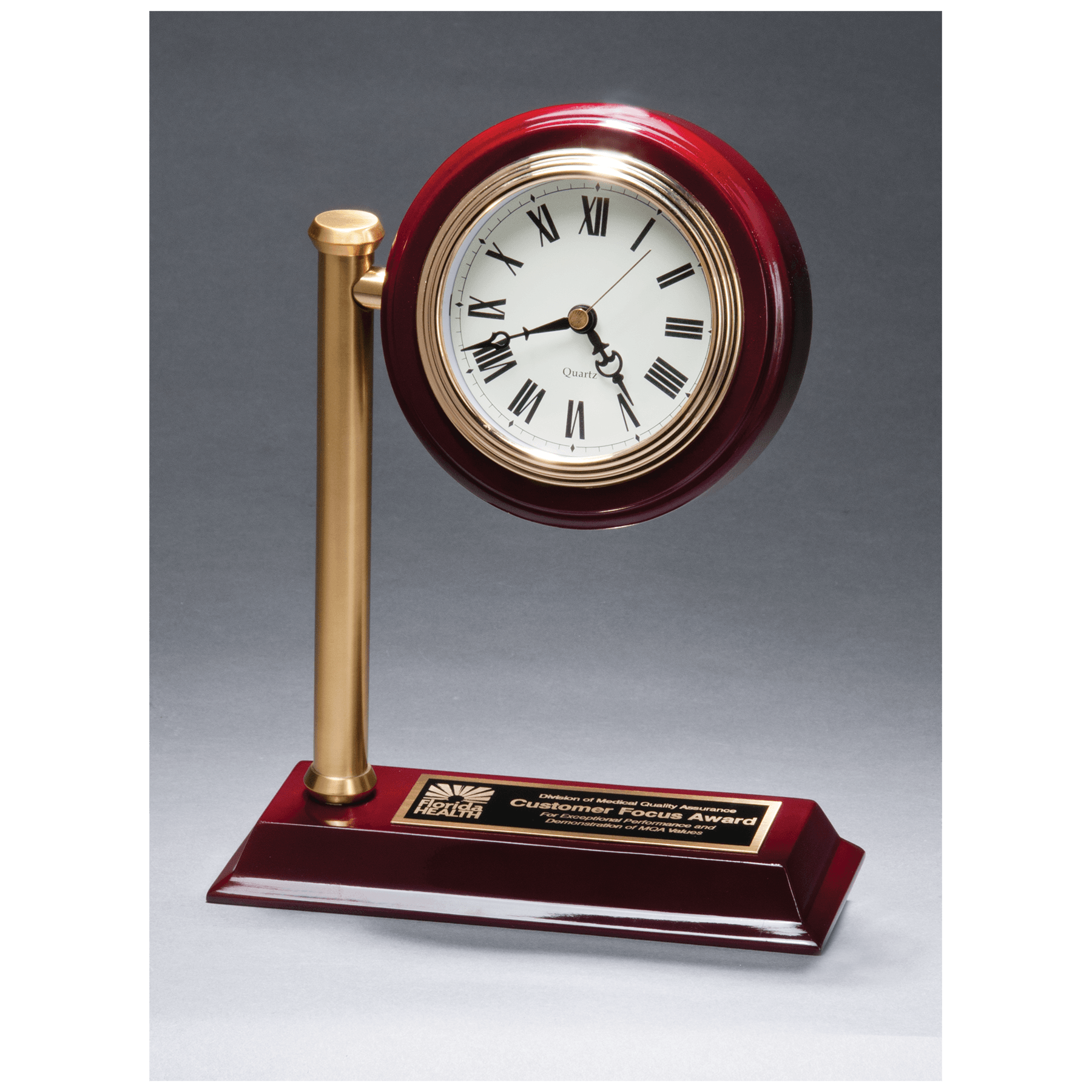 Rail station style desk clock on a rosewood high gloss base