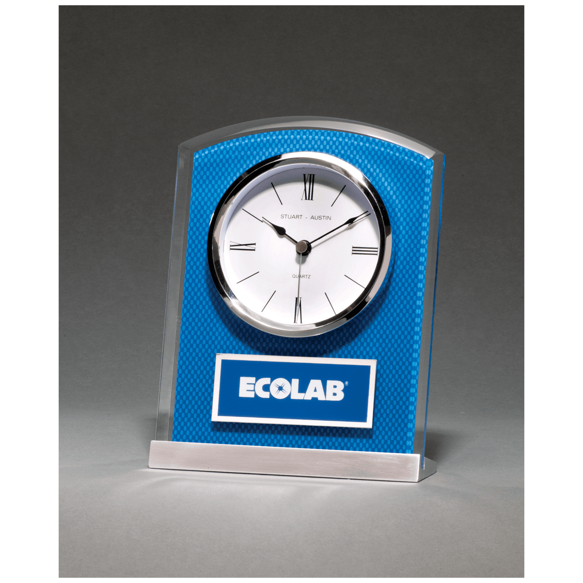 Glass clock with blue carbon fiber design on aluminum base