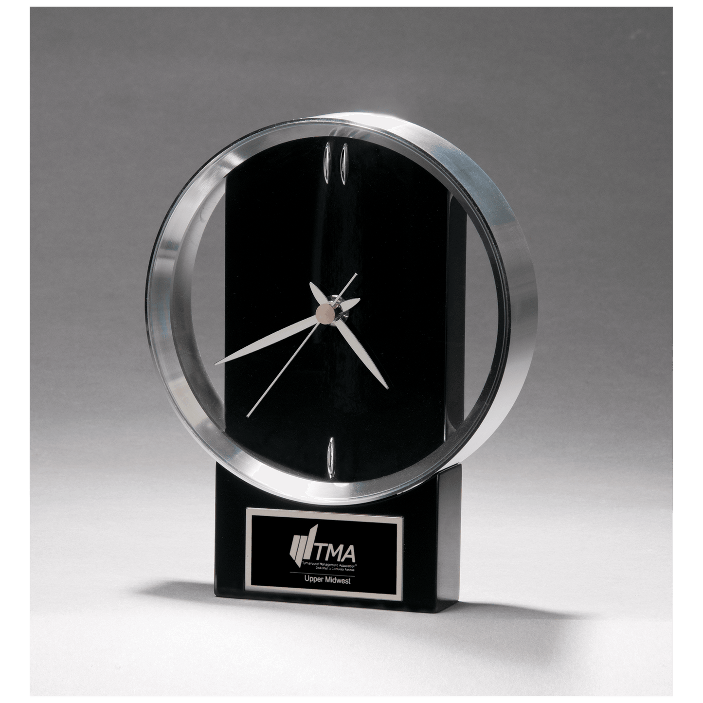 Modern design clock with brushed silver bezel on a black high gloss base