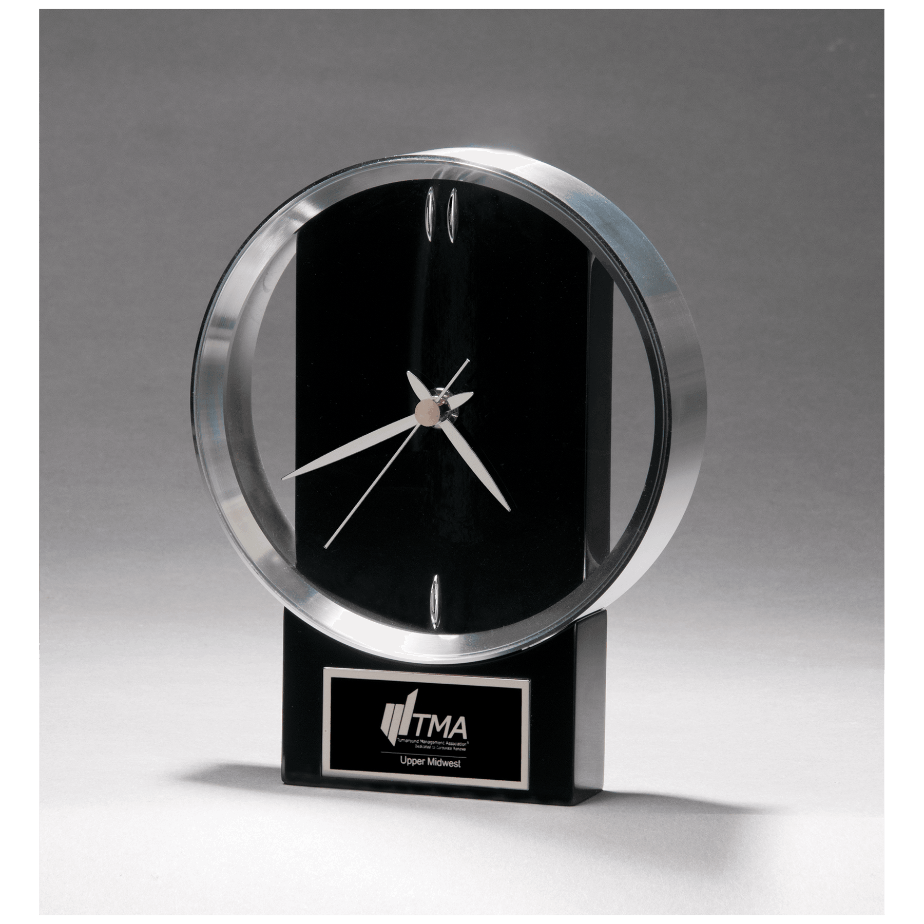 Modern design clock with brushed silver bezel on a black high gloss base
