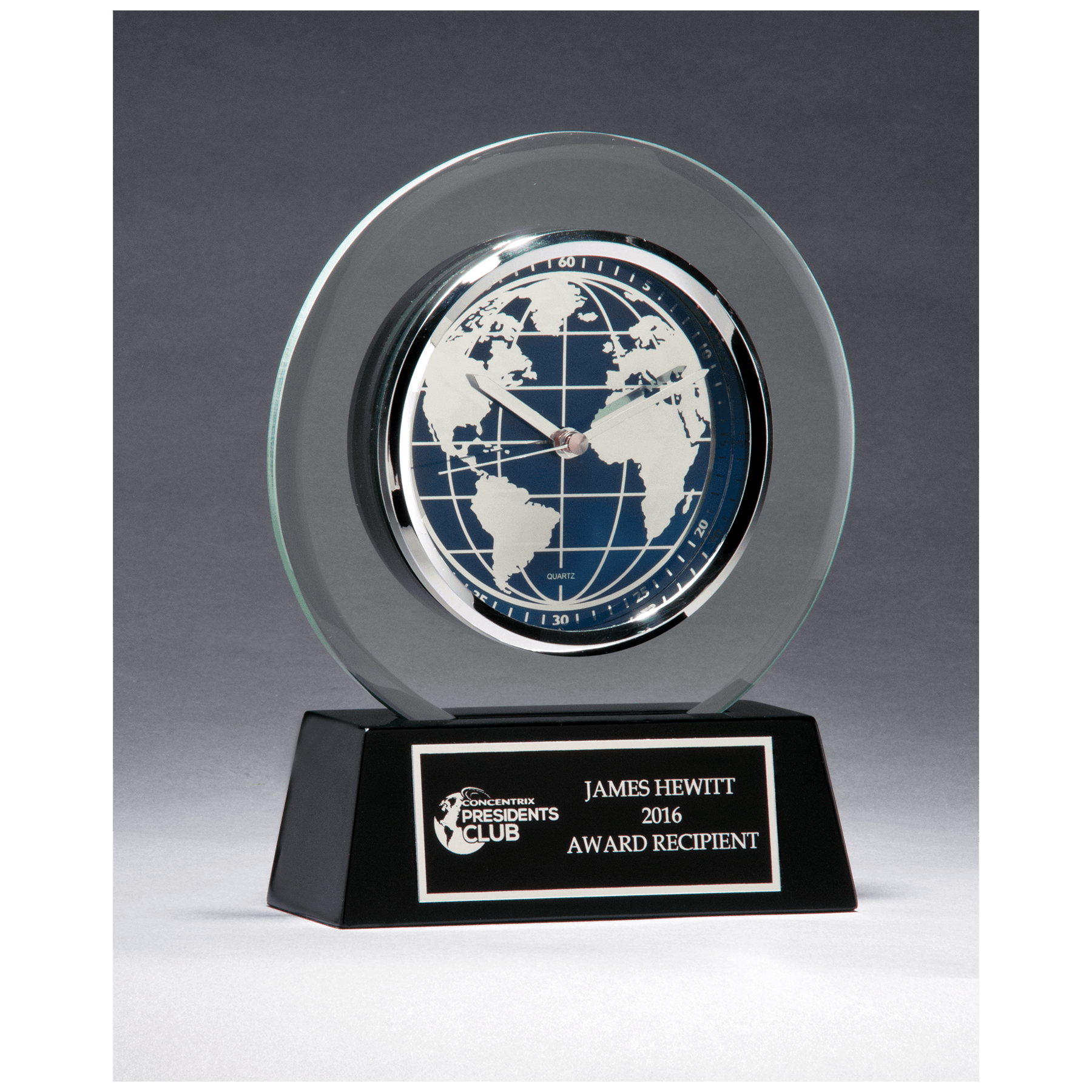 Glass clock with world time dial on a black high gloss base