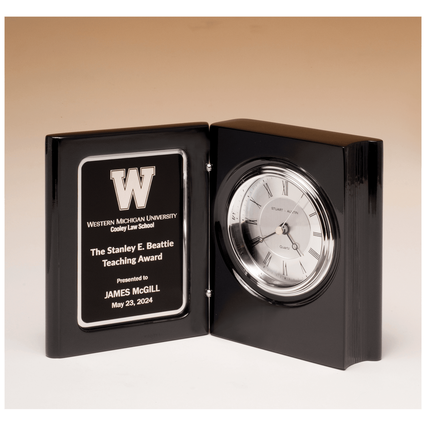 Black piano finish book clock with diamond spun dial and three hand movement