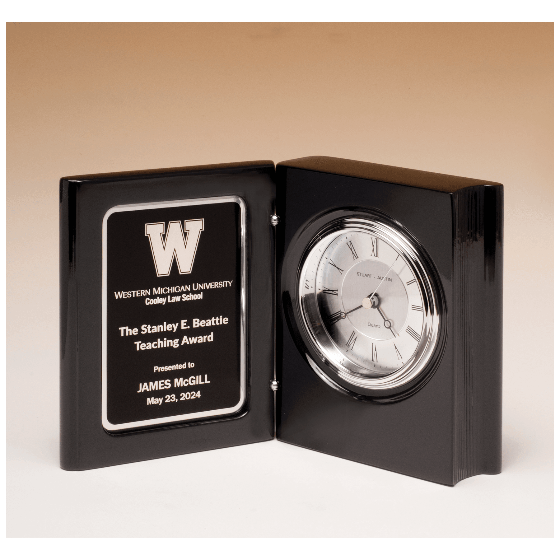 Black piano finish book clock with diamond spun dial and three hand movement