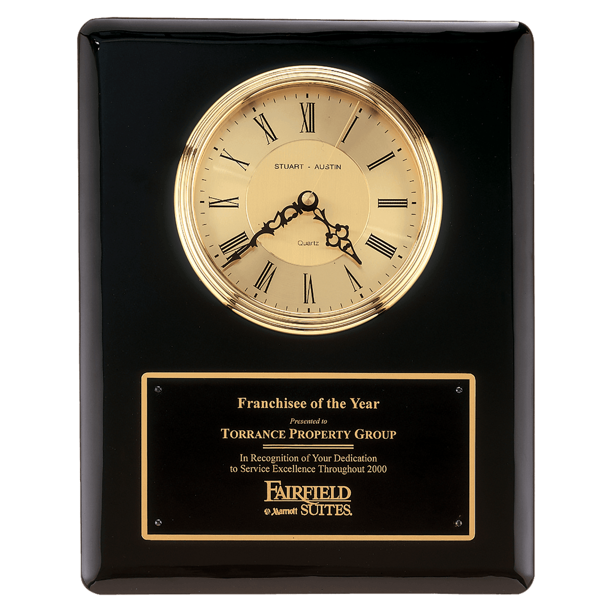 Black piano finish wall clock with waterfall bezel, glass lens and gold dial