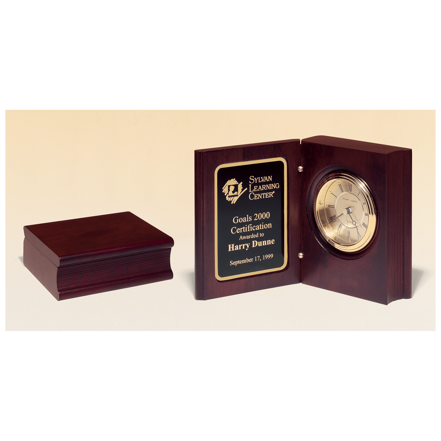 Hand rubbed mahogany book clock with gold spun dial and three hand movement