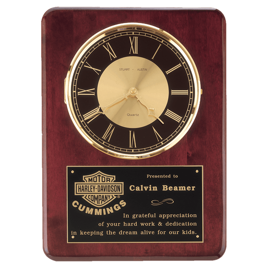 Rosewood piano finish wall clock with brass bezel, glass lens and black and gold dial