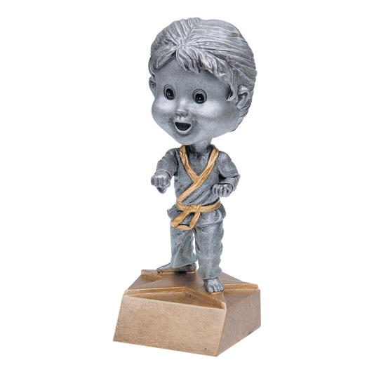 Karate bobblehead trophy with a silver young female student in a gi and gold belt on a tan base