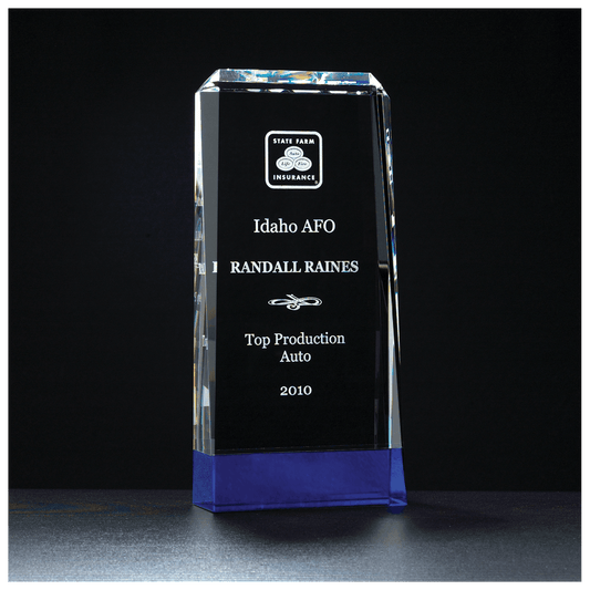 Crystal award with State Farm Insurance logo and engraved text on a black background