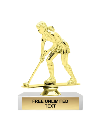 Gold trophy of a female field hockey player on a white background