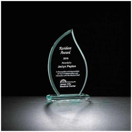 Jade green glass flame award on a matching glass base, engraved with a recognition message and company logo