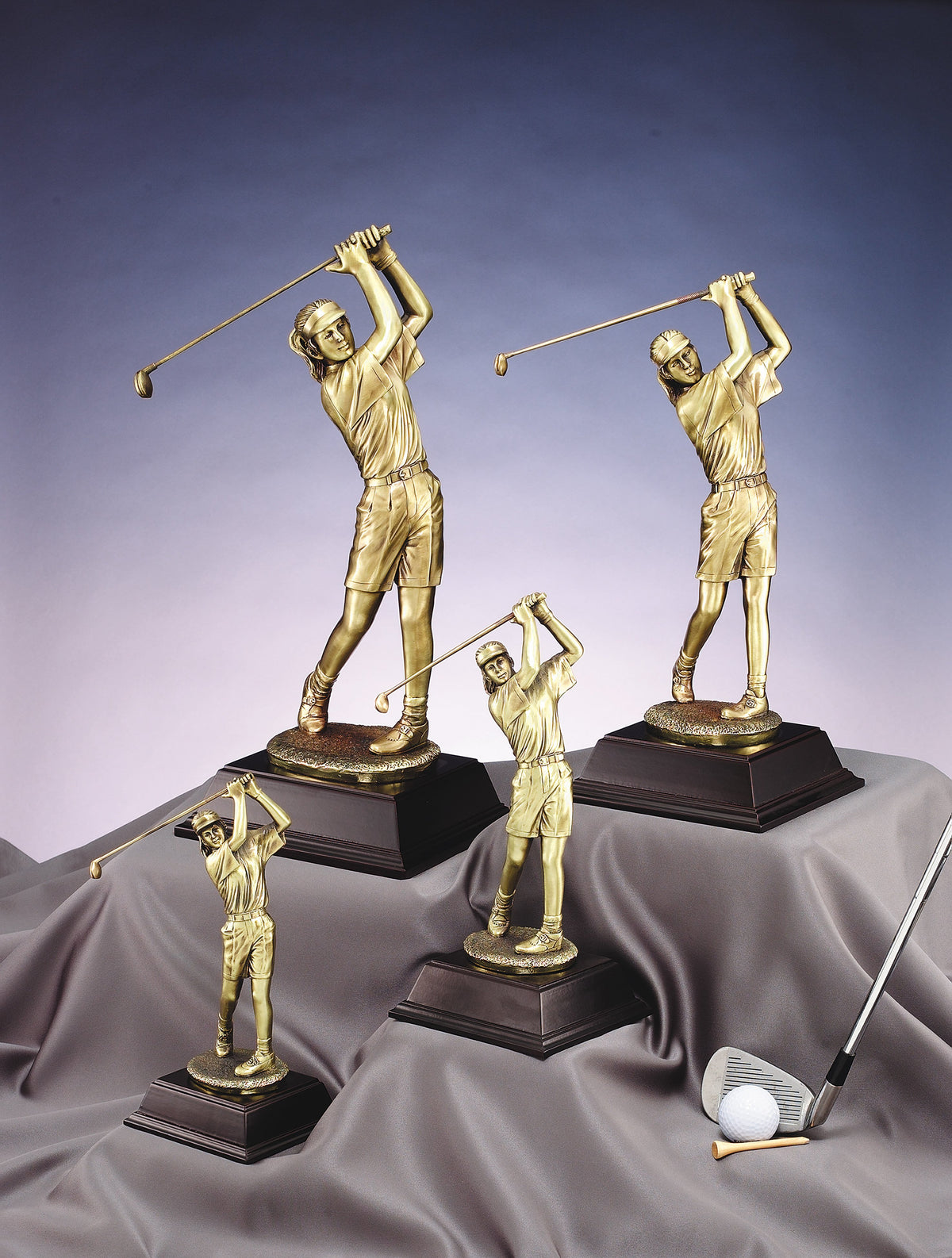 Gold female golfer in full swing, 10" size