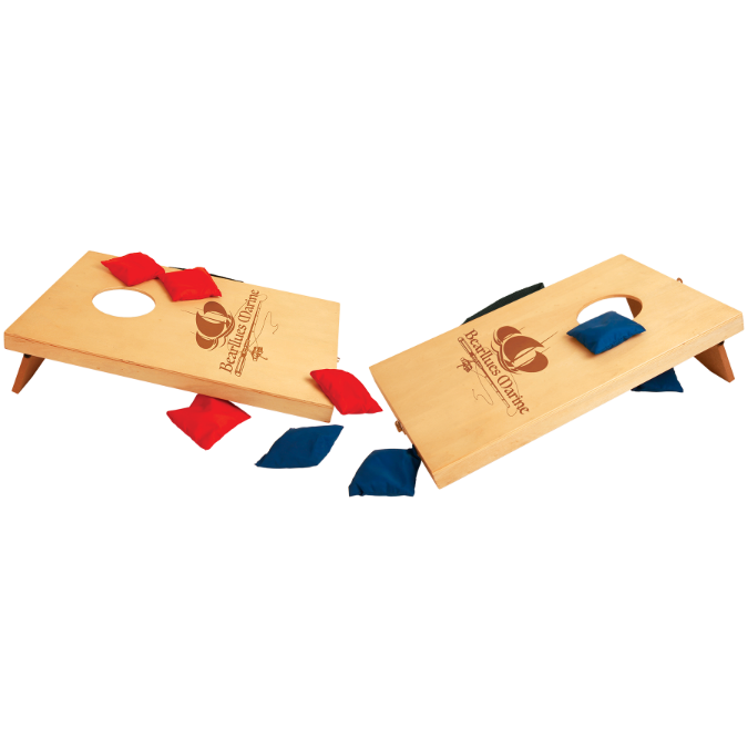 Two mini wooden cornhole boards with red and blue bags