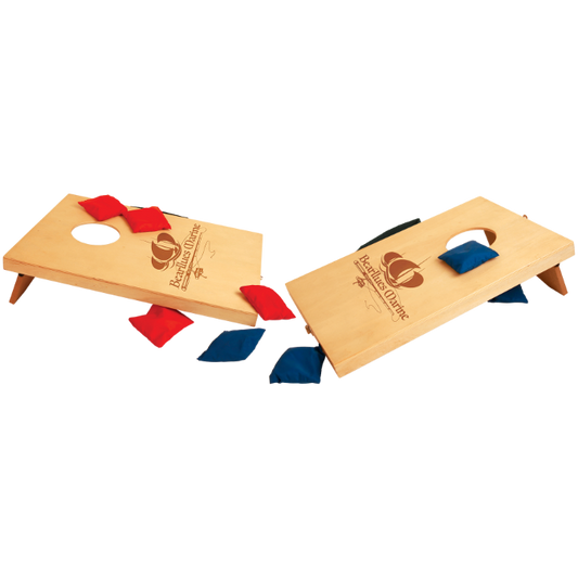 Two mini wooden cornhole boards with red and blue bags