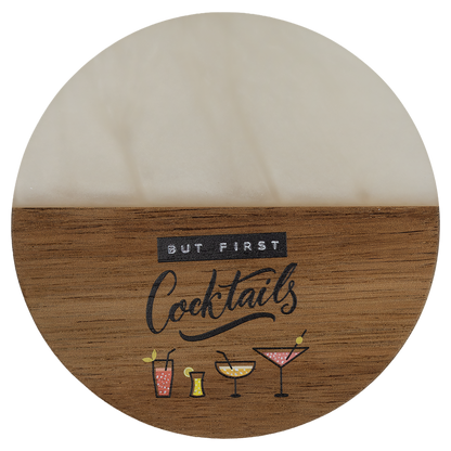 Engraved round acacia and white pearl resin coaster with a drink