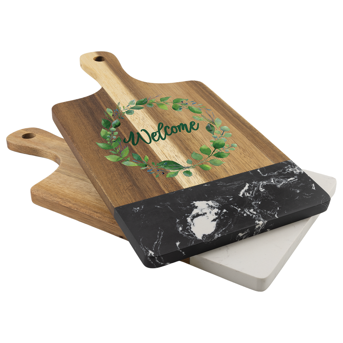 Stacked acacia and marble cutting boards styled on a counter