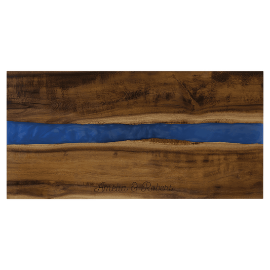 Wooden cutting board with a blue resin inlay on a transparent background