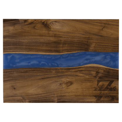 Wooden cutting board with a blue resin inlay