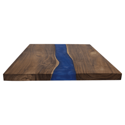Wooden cutting board with a blue resin river design on a transparent background