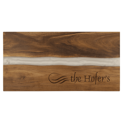 Wooden cutting board with 'the Hofer's' branding on a clear background