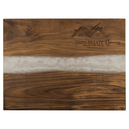 Wooden cutting board with white marble inlay and 'Twin Estate' branding.