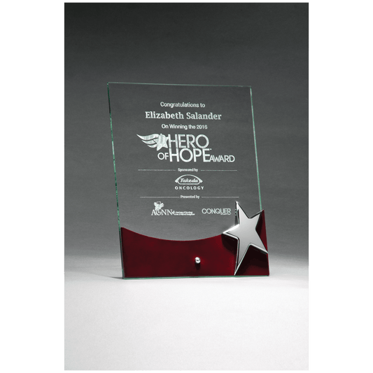 Glass award with star design on a gray background