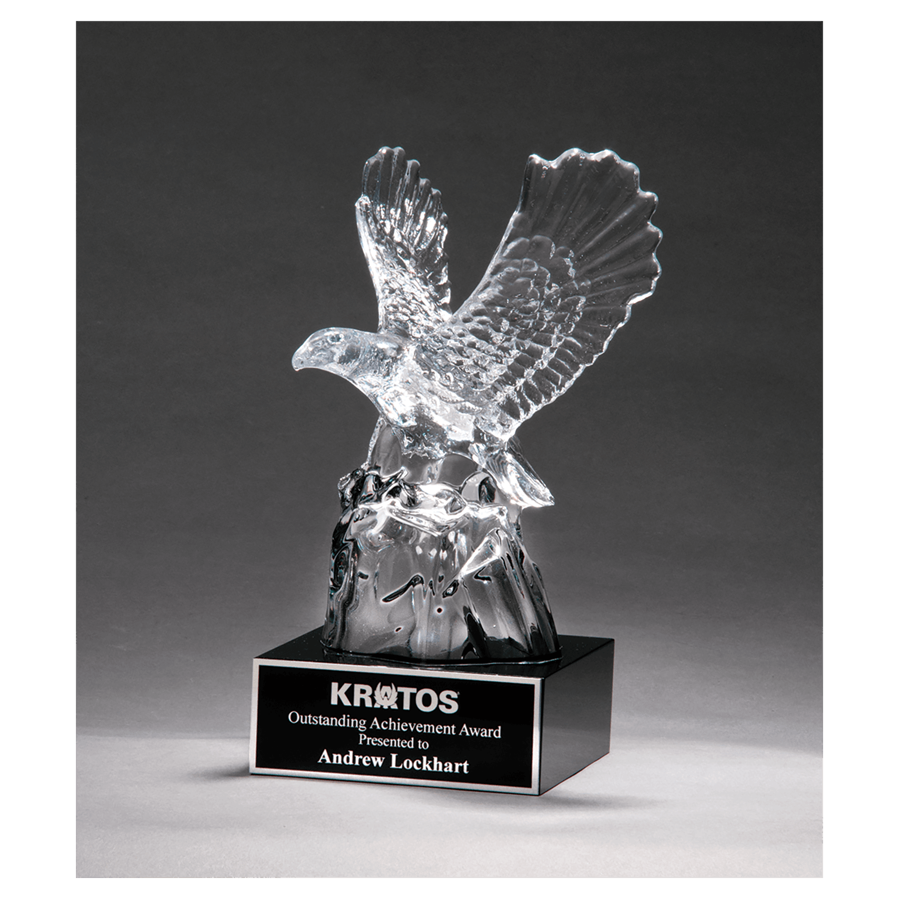 Carved crystal eagle award mounted on a black crystal base with a black engravable aluminum plate, 9.5 inches tall