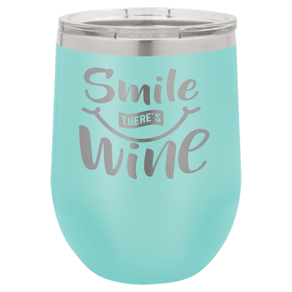 Turquoise wine tumbler with 'Smile, There's Wine' text on a white background