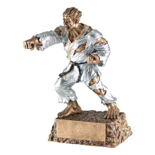 Hand-painted gold and silver resin trophy of a muscular monster in a karate gi in a fighting stance, on a textured base with a blank engraving plate