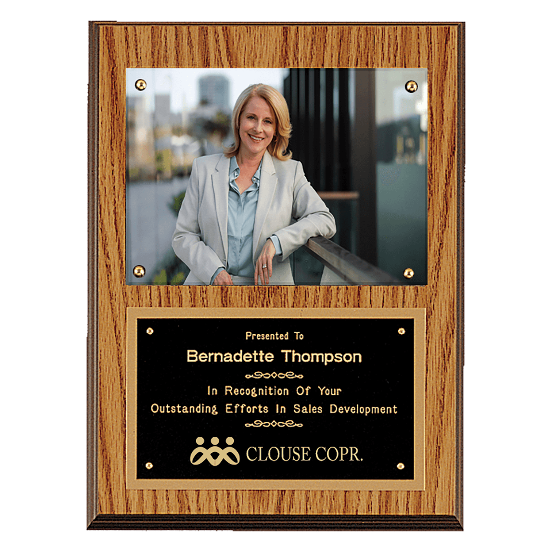 Oak finish 9 by 12 inch photo plaque with black brass engraving plate holding a 5 by 7 inch photo