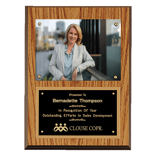 Oak finish 9 by 12 inch photo plaque with black brass engraving plate holding a 5 by 7 inch photo