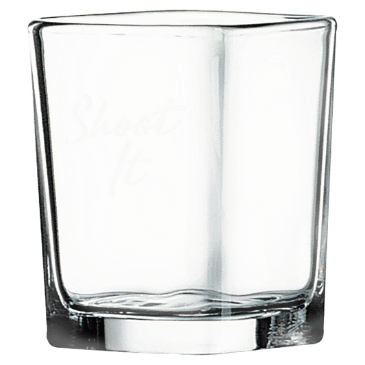 Clear square 2 ounce shot glass with a heavy base and a frosted etched design on a light background