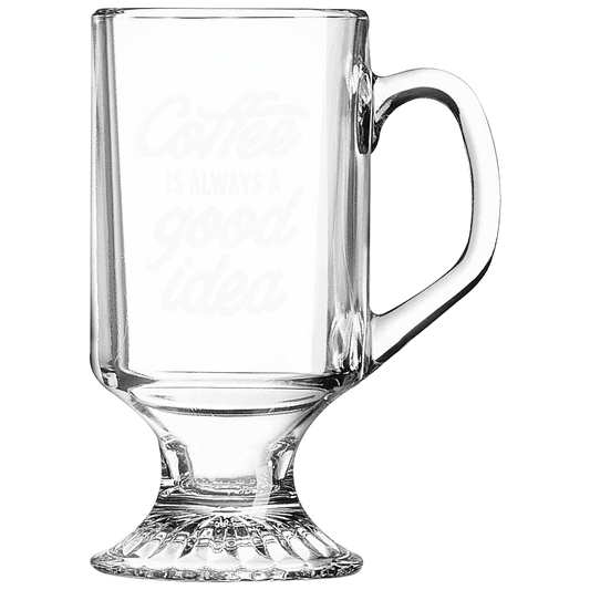 Clear 10 oz. footed glass coffee mug with a handle and a frosted etched design on a light background