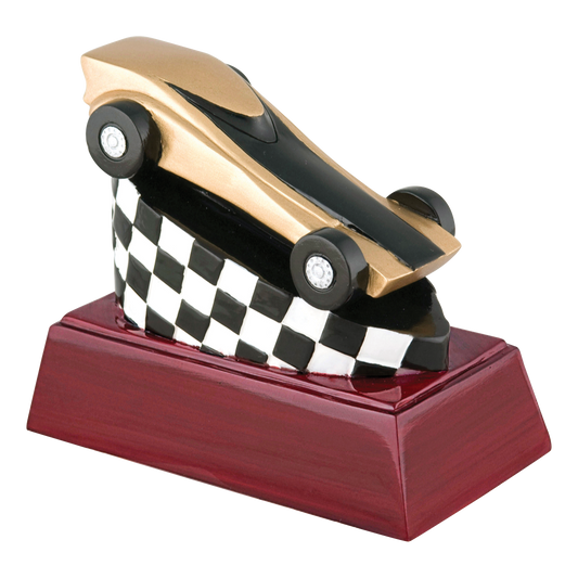Pinewood derby trophy with a gold and black car over a checkered flag on a rosewood-finish base