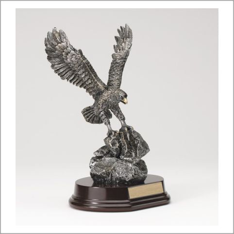 Pewter-finish eagle on a rocky base with gold accents