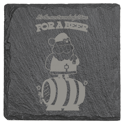 Slate coaster with engraved design of  Santa and text, on a white background